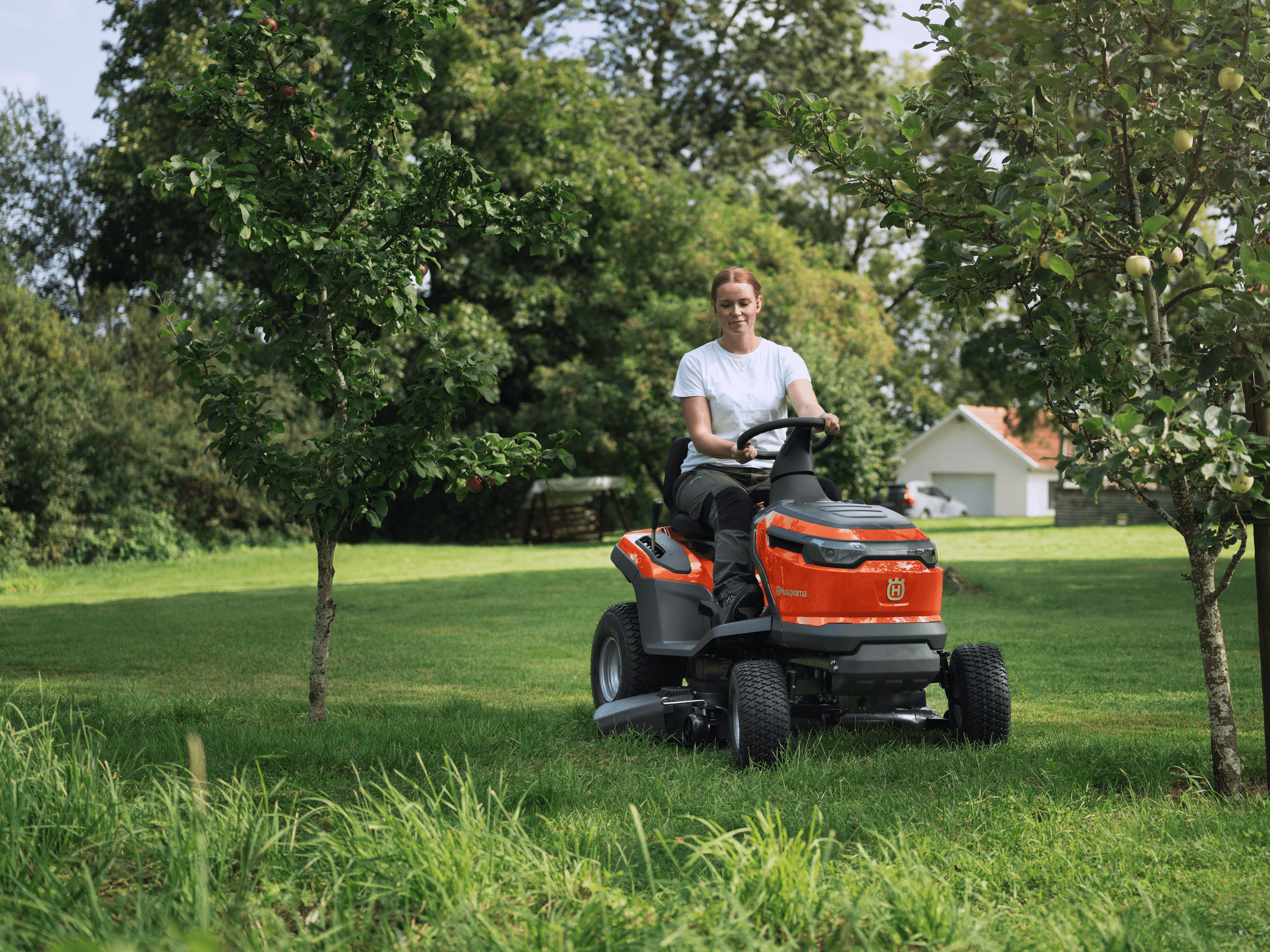 women mowing lawn